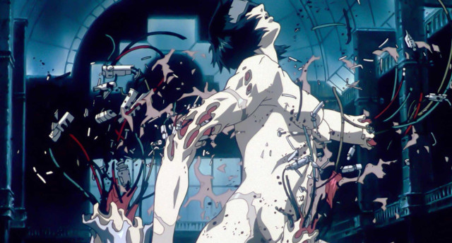 Ghost in the Shell - Ein philosophisches Meisterwerk des Cyberpunk-Anime - Kaneda hält eine schwere Laser-Kanone